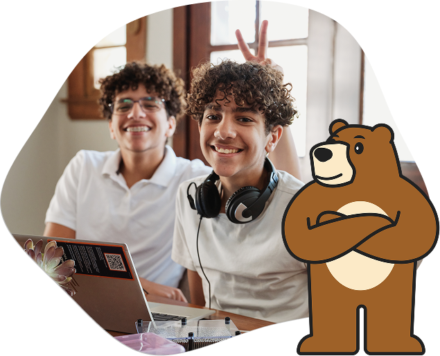 California Virtual Academies students working together with theri laptop. Bear mascor is also displaying in this image next to the students.