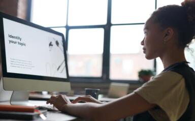High School student using her computer.