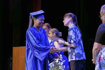 Graduate student receiving her diploma image