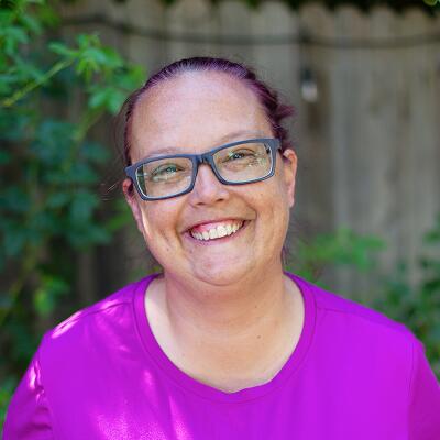 Jennifer, parent of a student, wearing a purple shirt